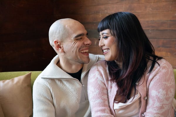E-L-love couple smiling at each other